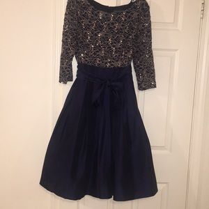 Beautiful navy and gold knee length dress.